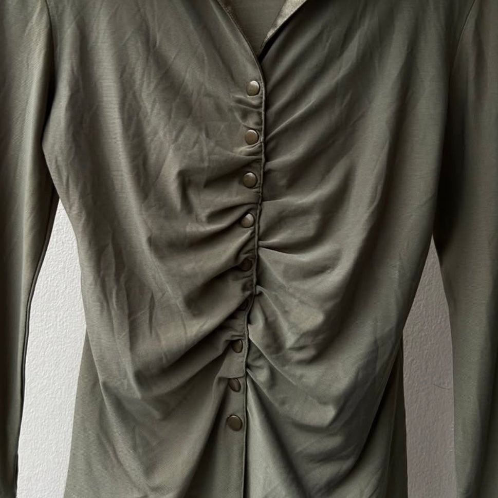 Green pleated shirt