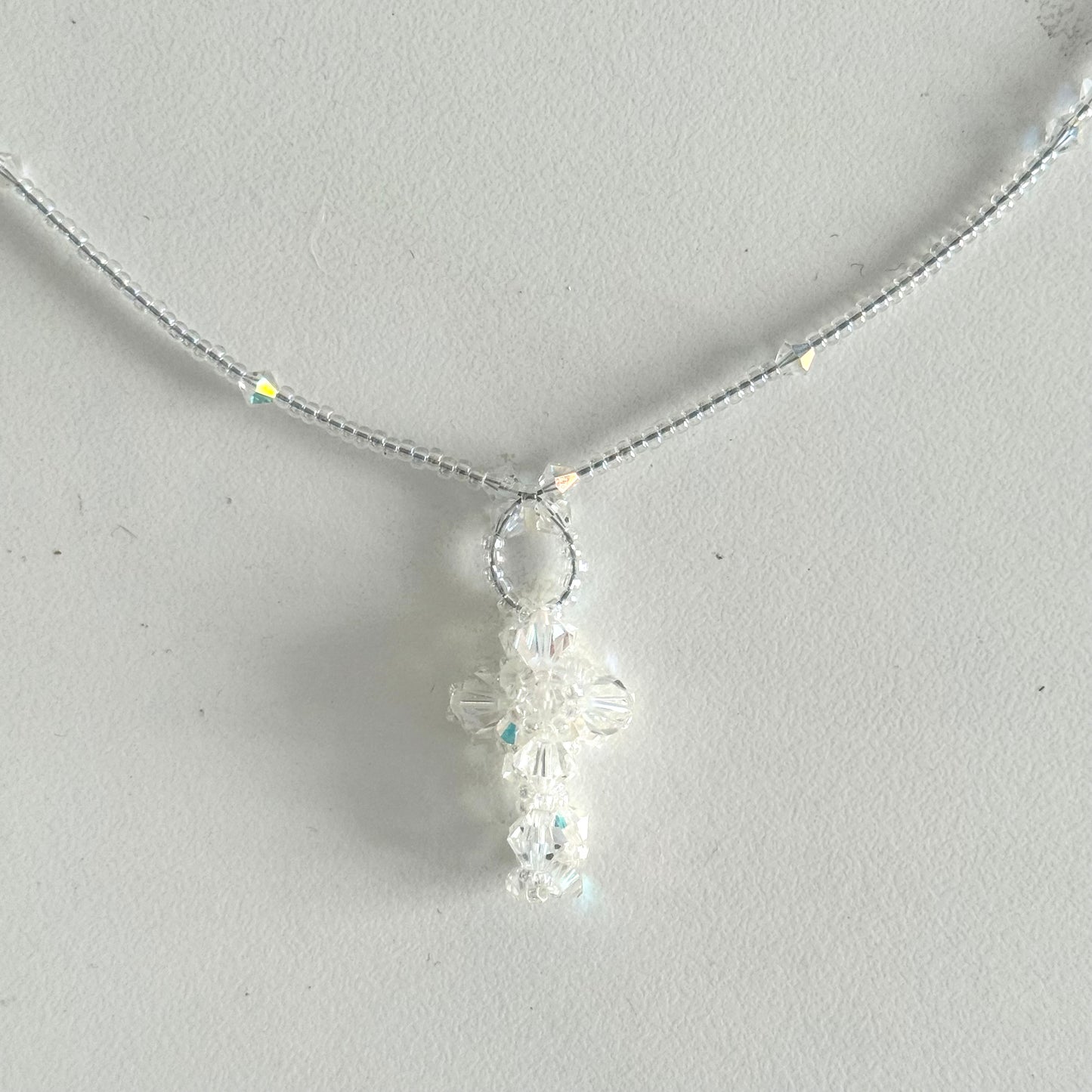 Transparent beads cross necklace