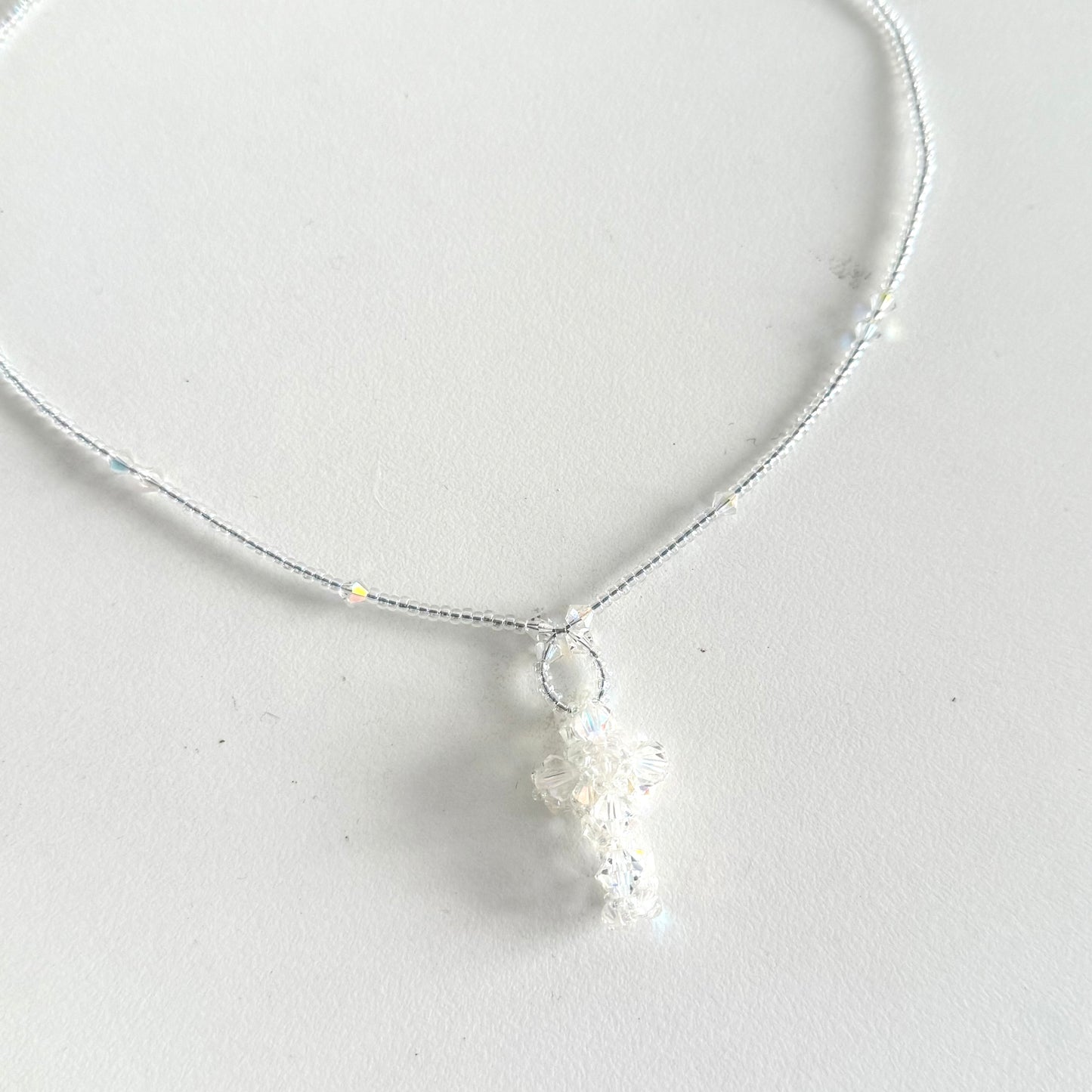 Transparent beads cross necklace
