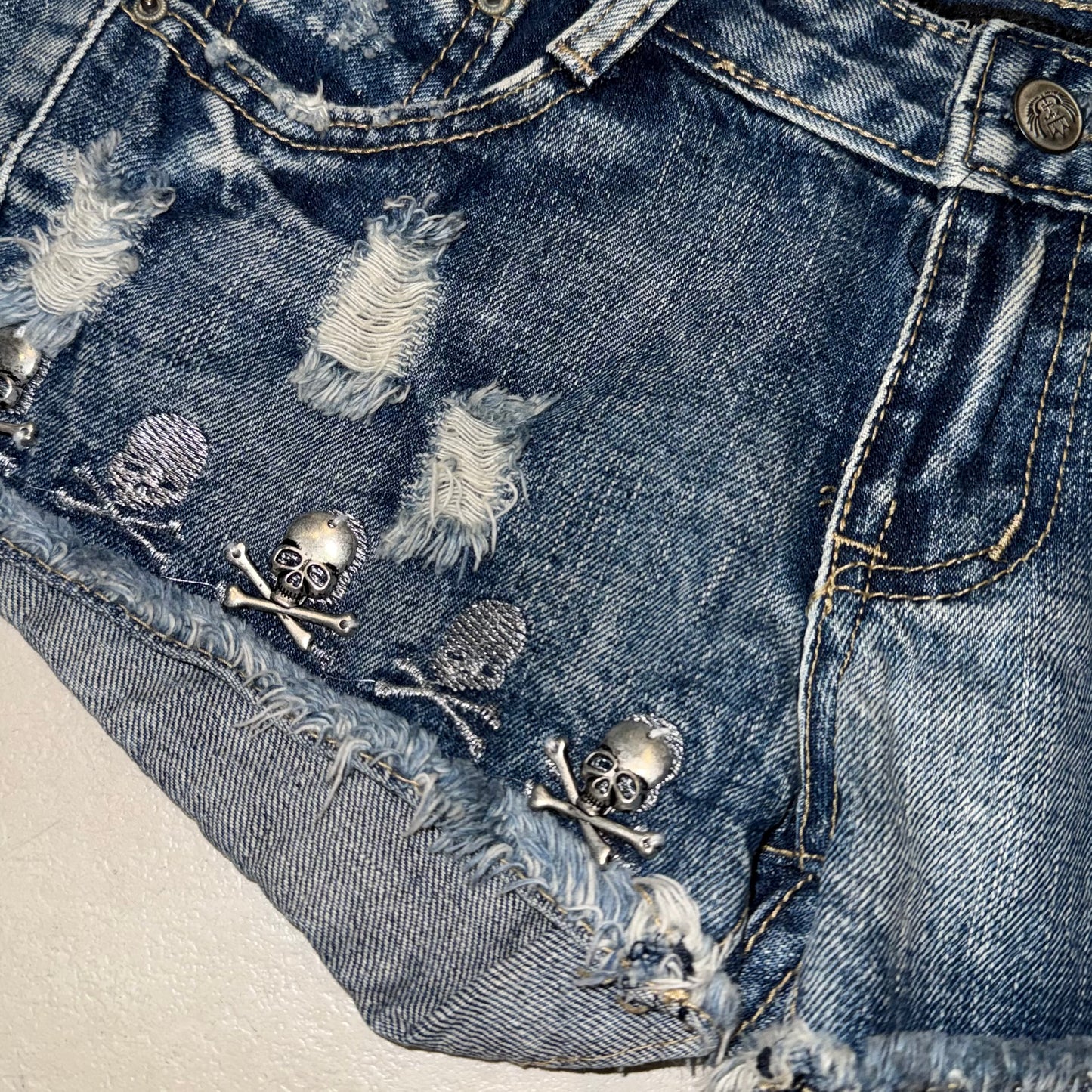 Skull denim shorts
