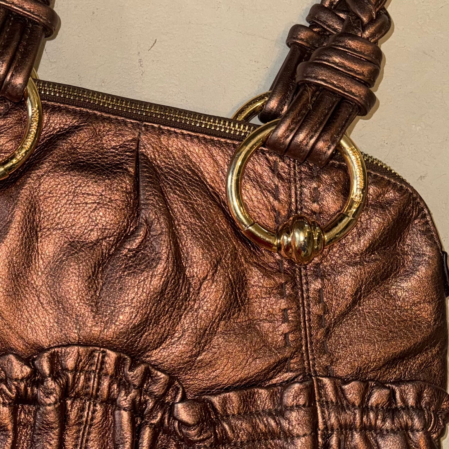 Brown leather shoulder bag with gold hardware