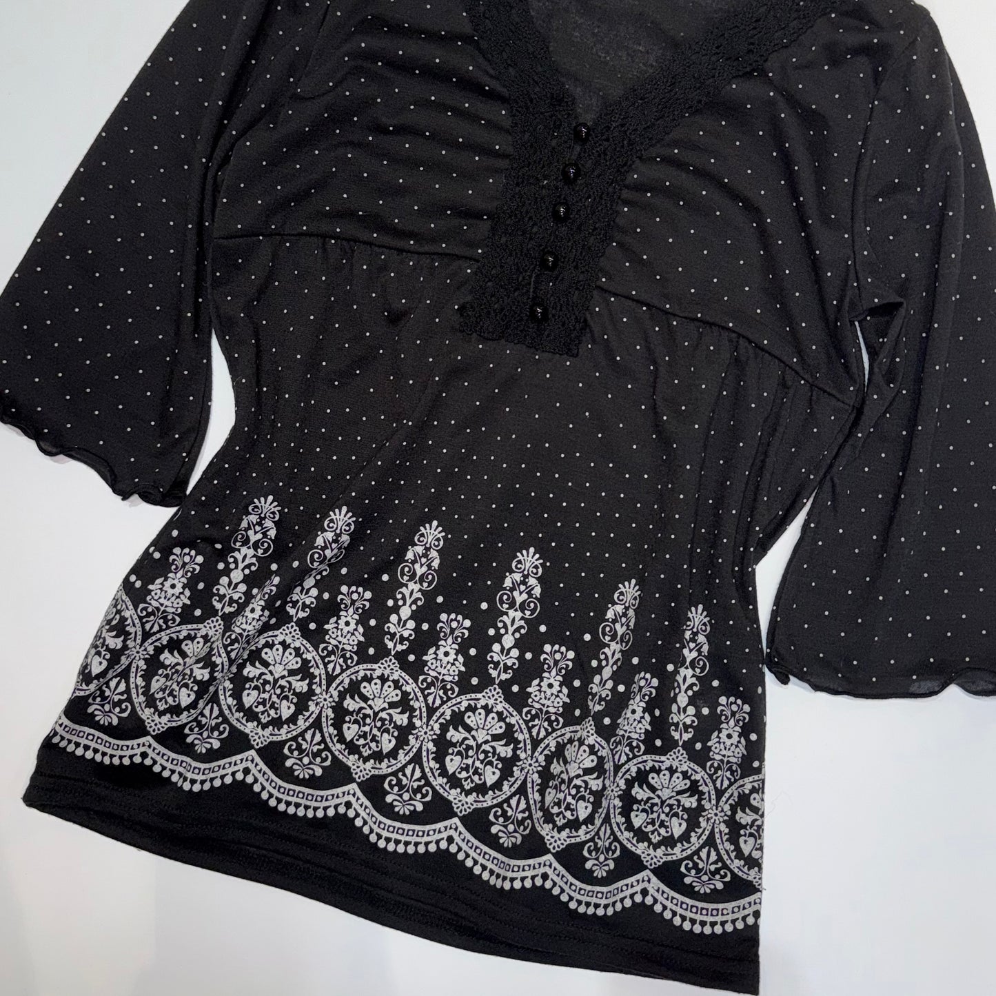 Black polka dot v-neck lace top with three quarter sleeve