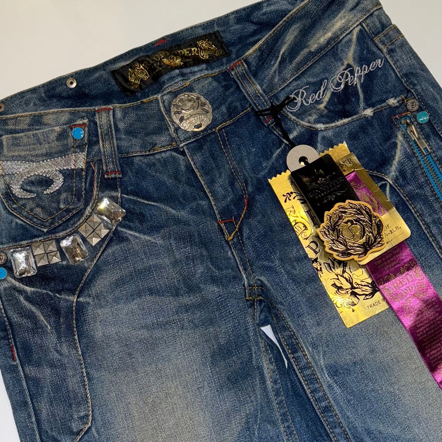 Red pepper embroidered low rise bootcut jeans