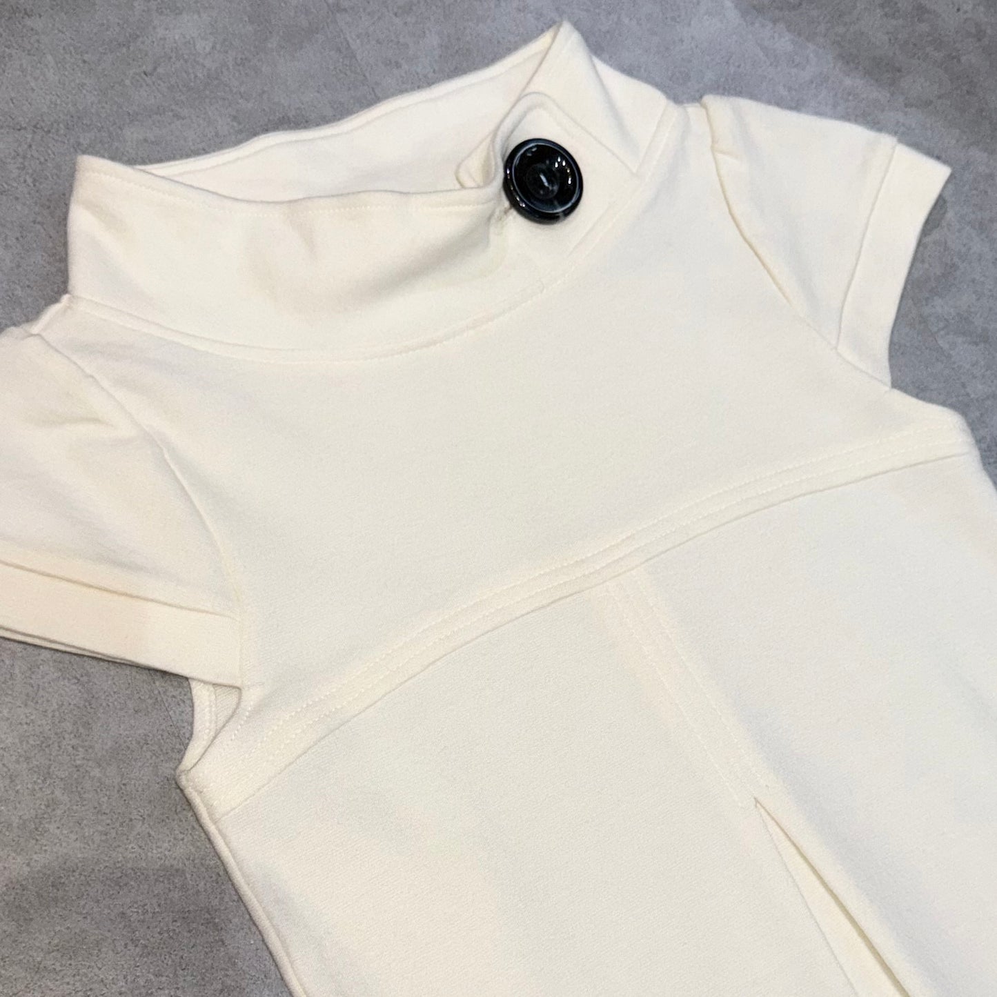 Cream mini dress with button detail