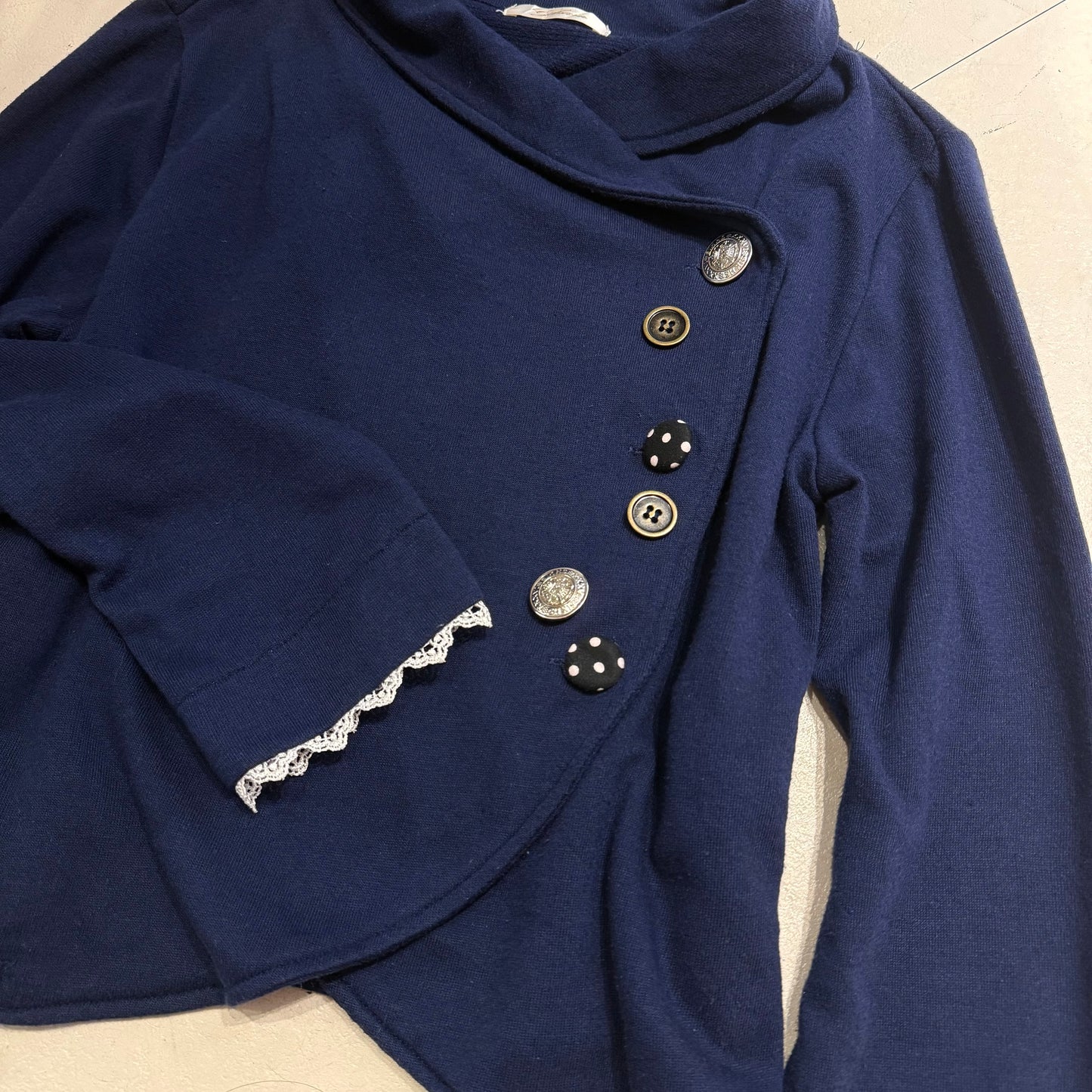 Navy outer with polka dot buttons detail
