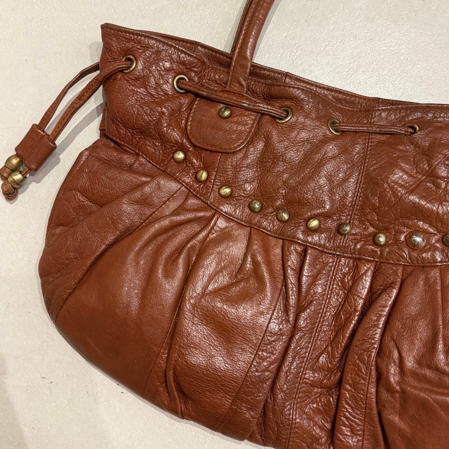 Brown rivets leather bag