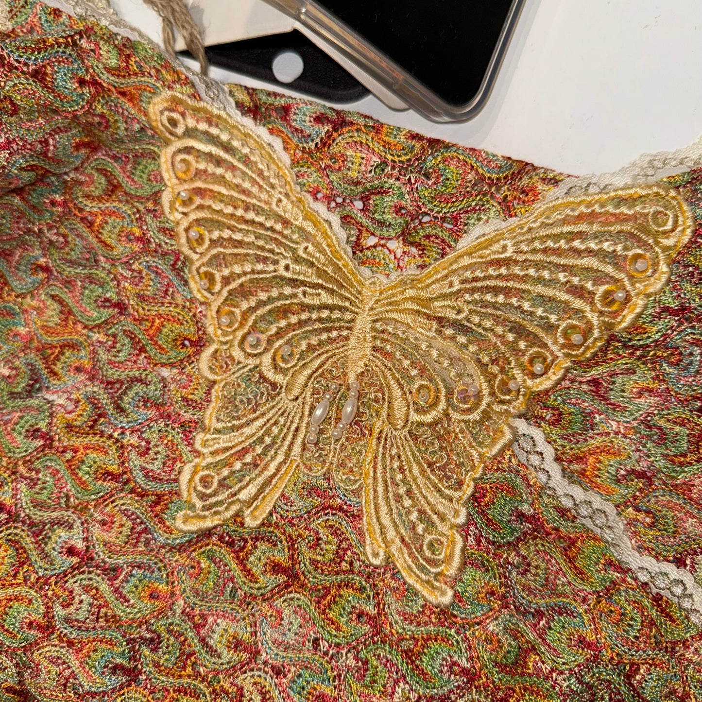 Colourful beaded butterfly knit tank