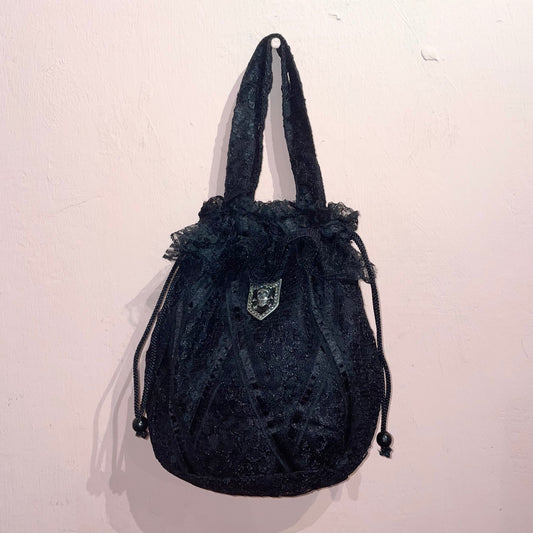 Black lace rose bag with skull pin