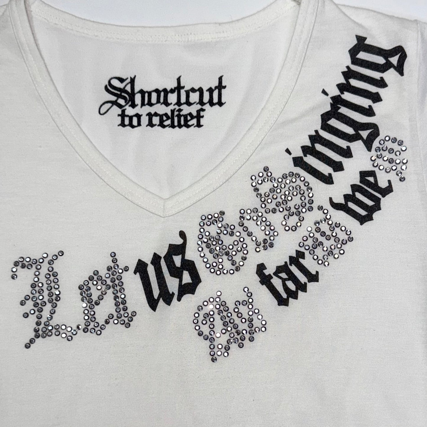 “Shnrtrut to relief” rhinestones white tee