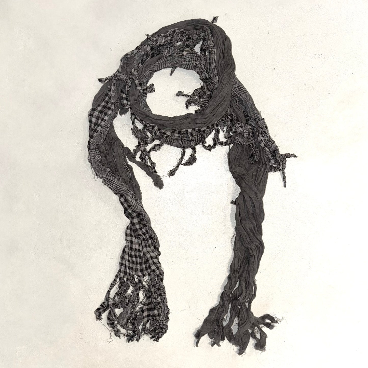 Grey black checkered scarf with frayed edges