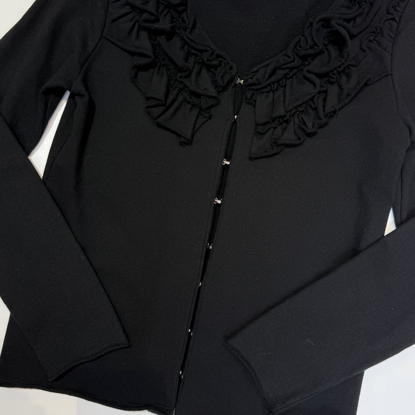 Black ruffle hook and eye outer
