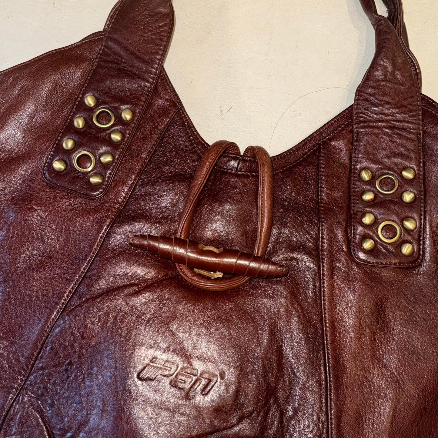 Burgundy leather studded hobo bag