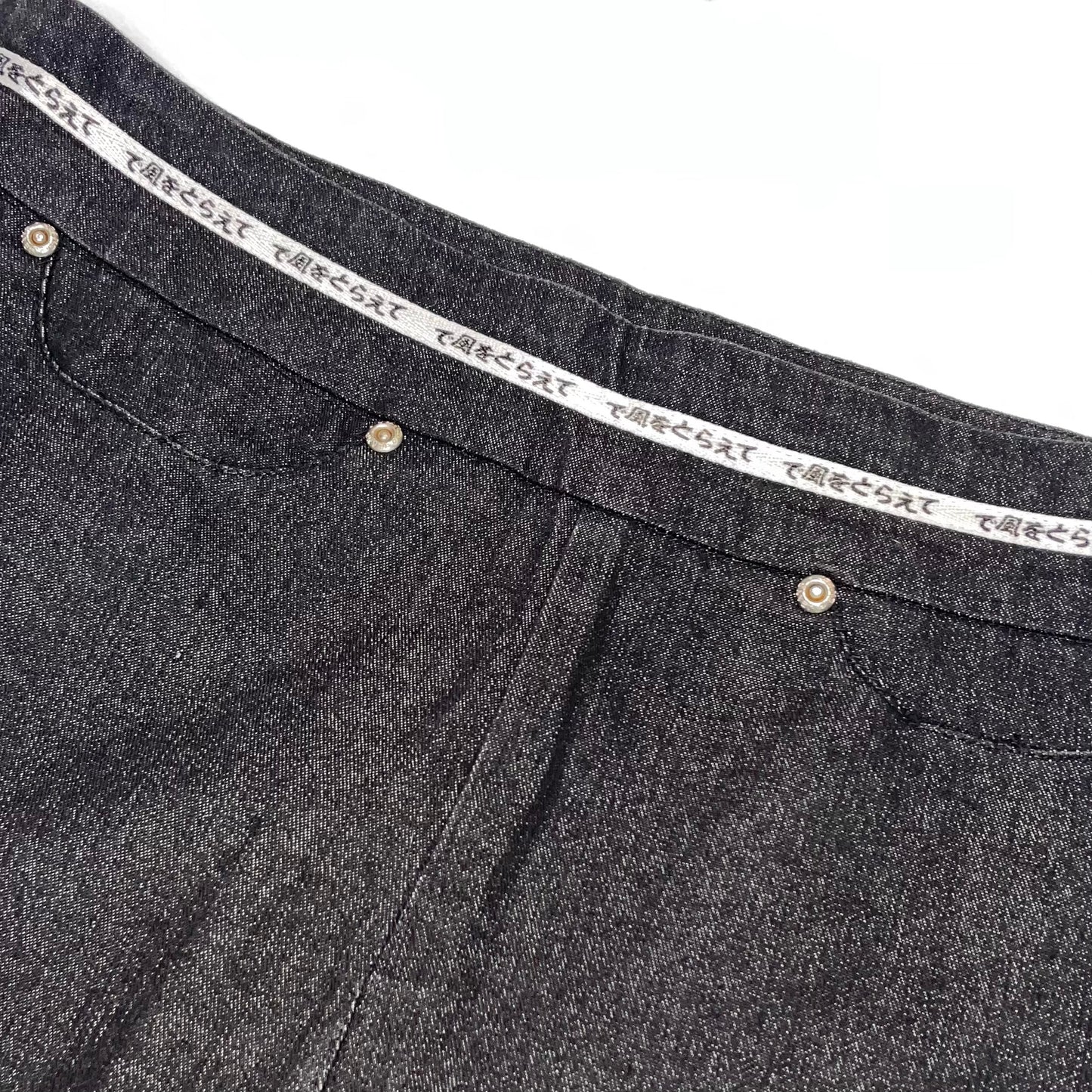 Black denim skirt with japanese waist band detail