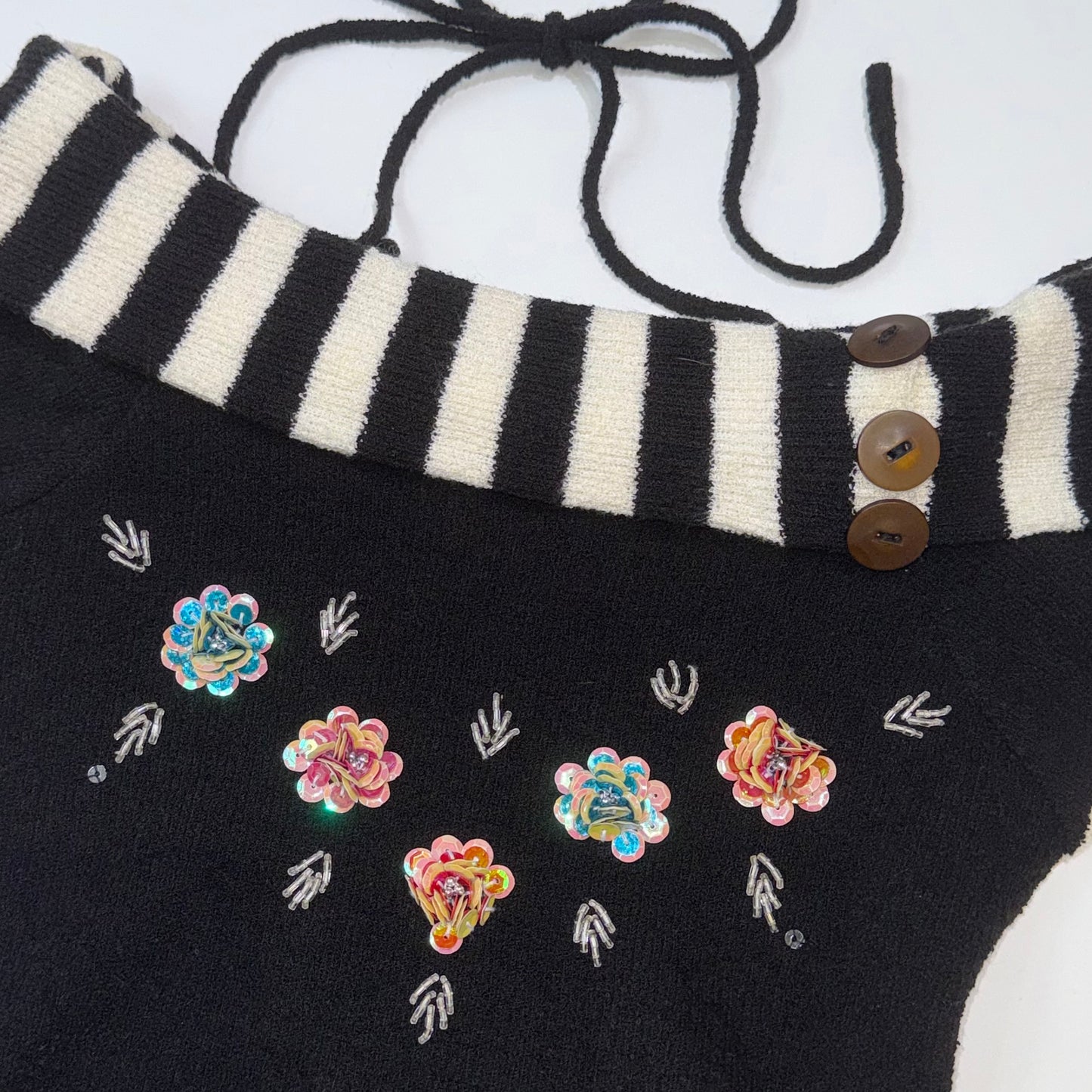 Embroidered floral black knit top