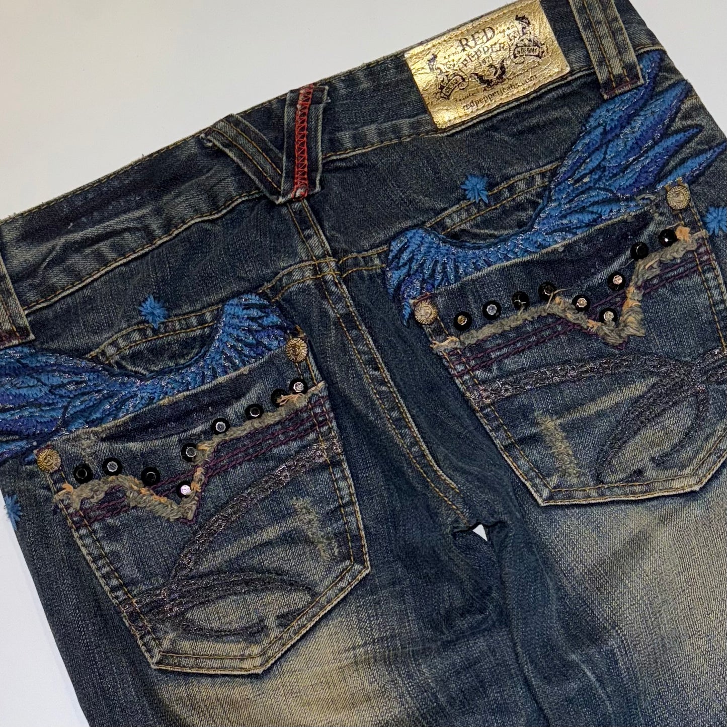 Red Pepper rivets embroidered wings low rise bootcut jeans