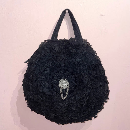 Black lace circle handbag with pin