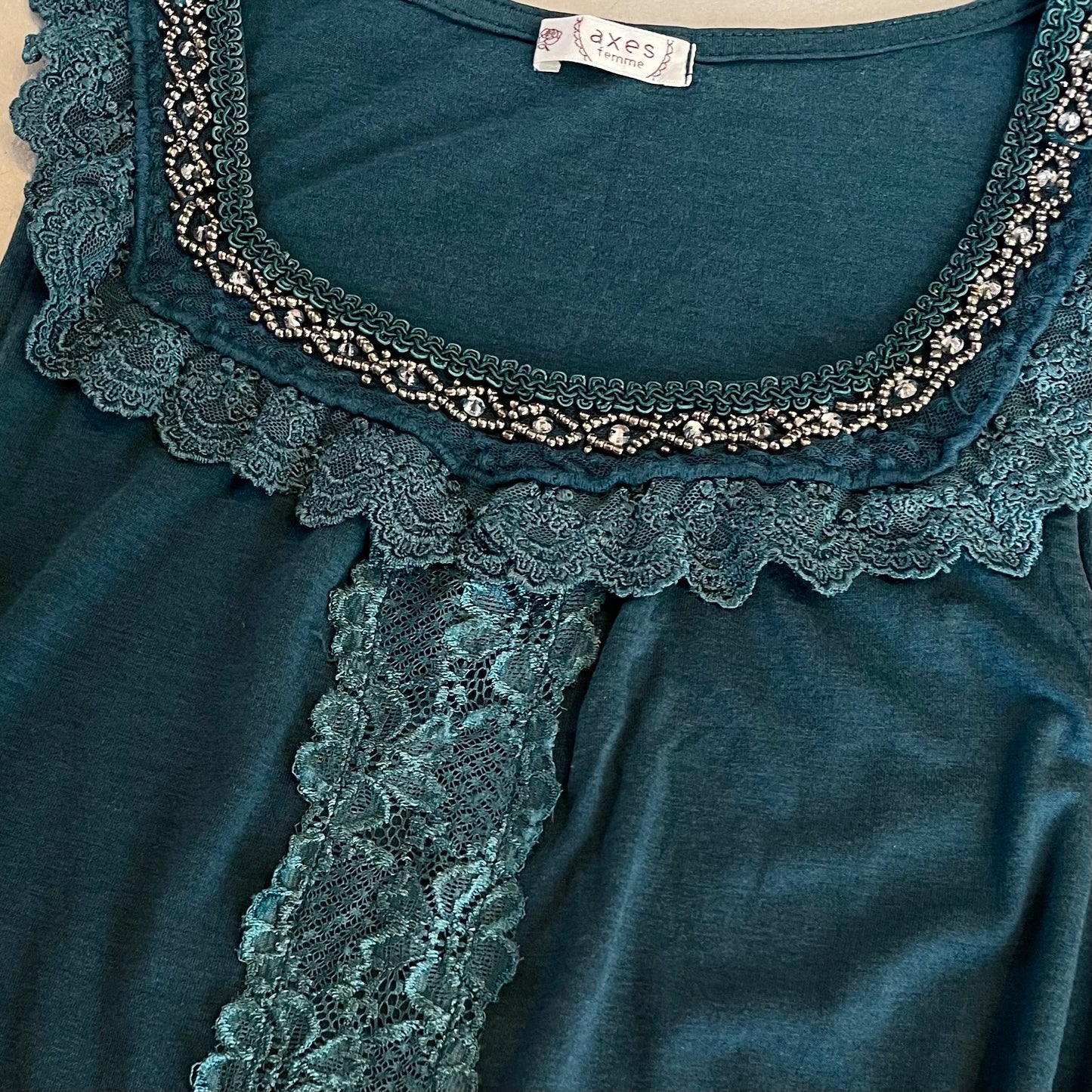 Axes teal lace top