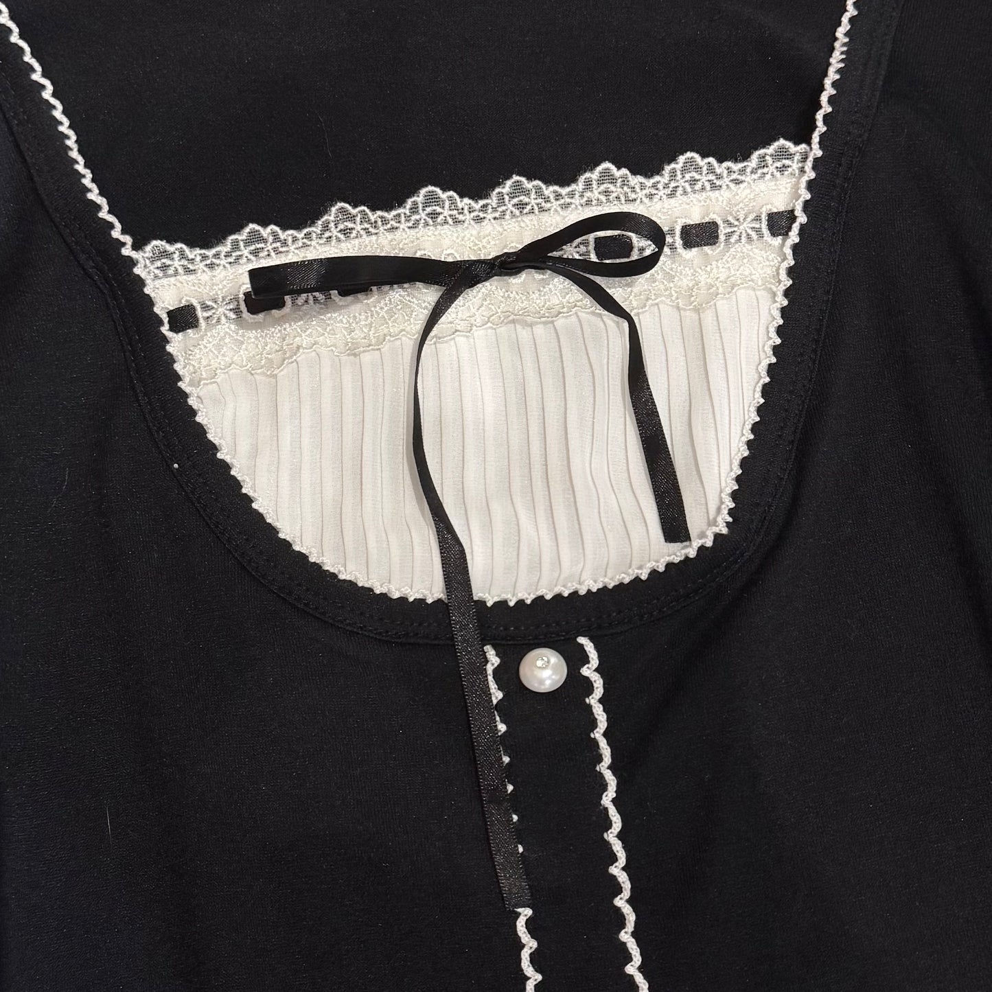 Black layered top with pearl details