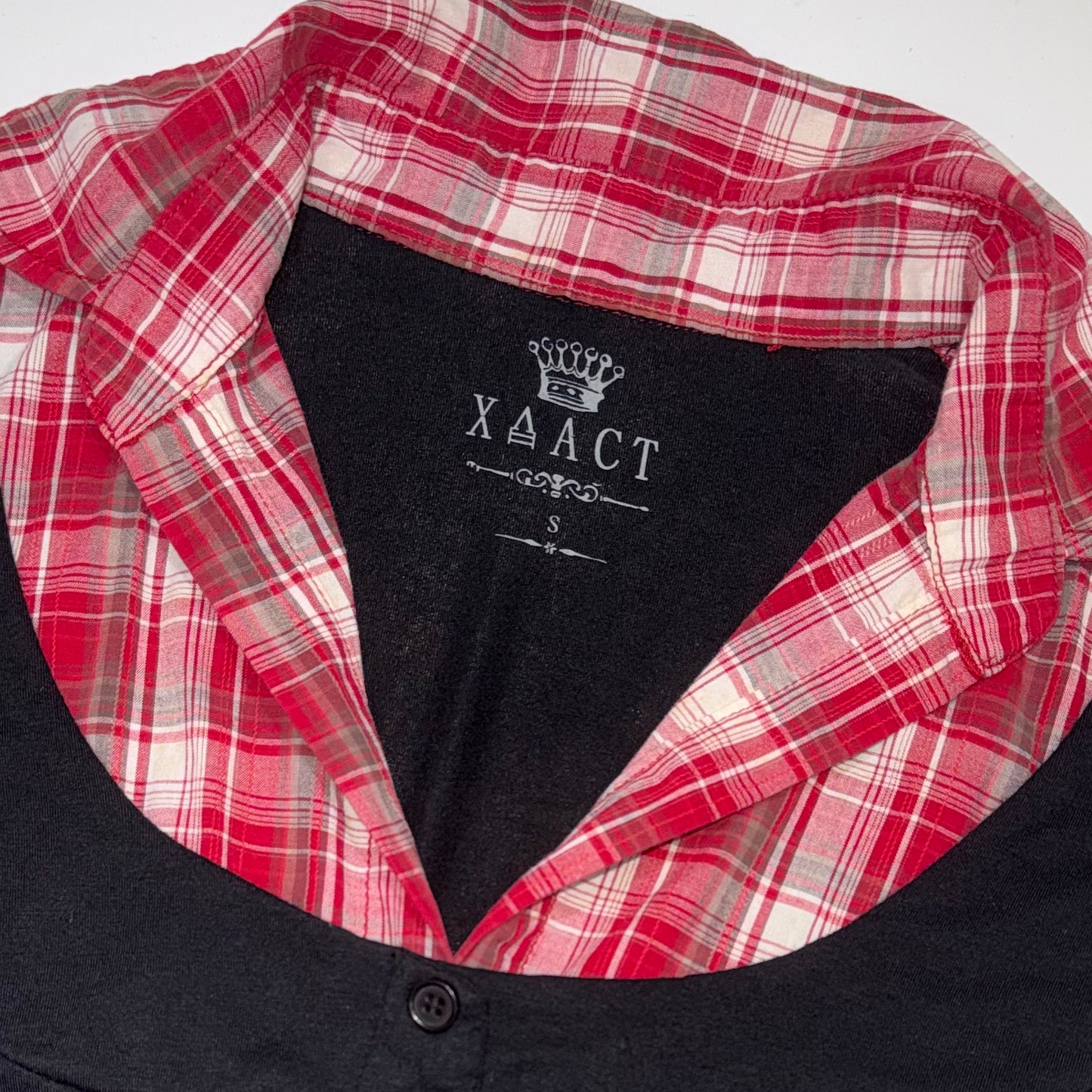 Layered red plaid shirt with black corset style vest