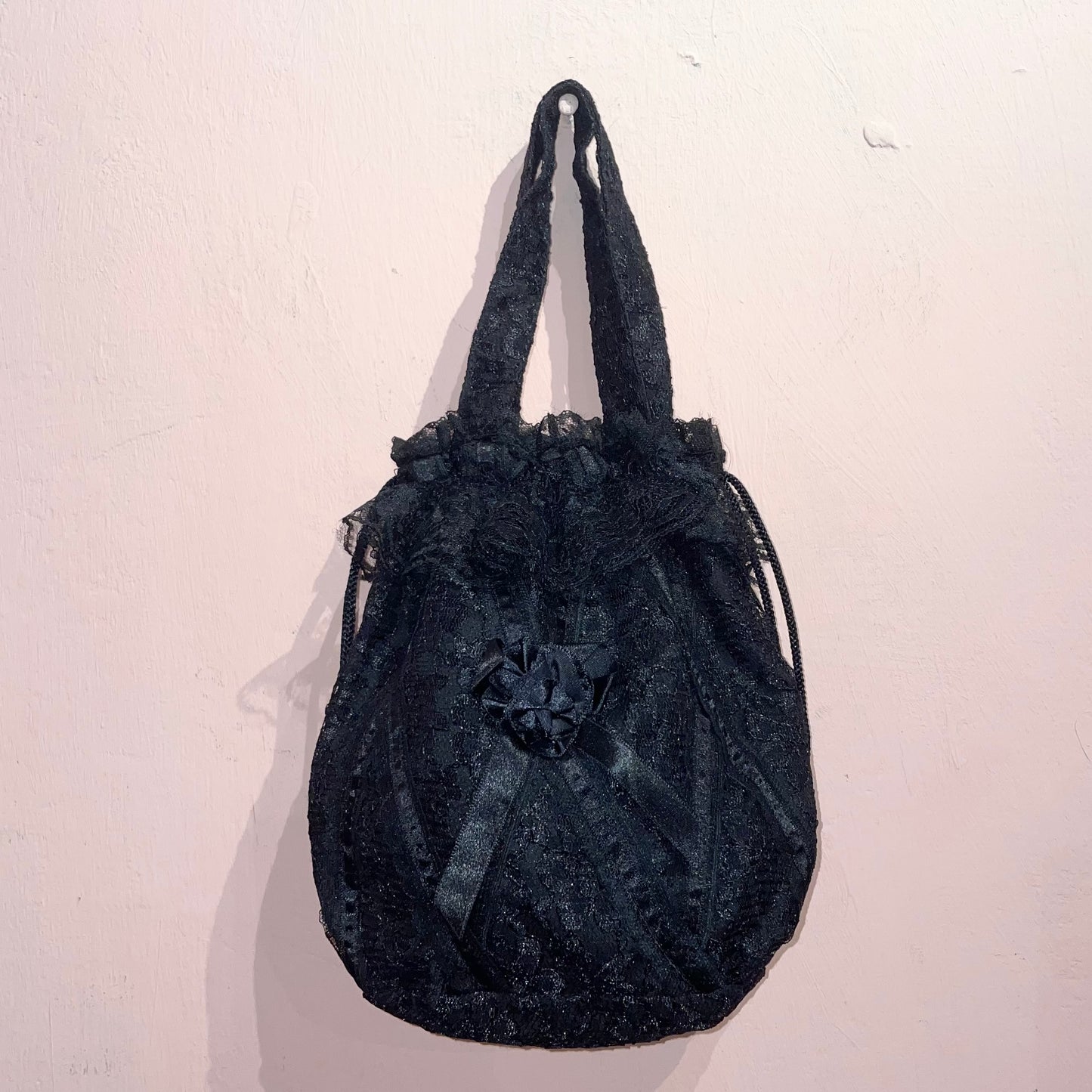 Black lace rose bag with skull pin