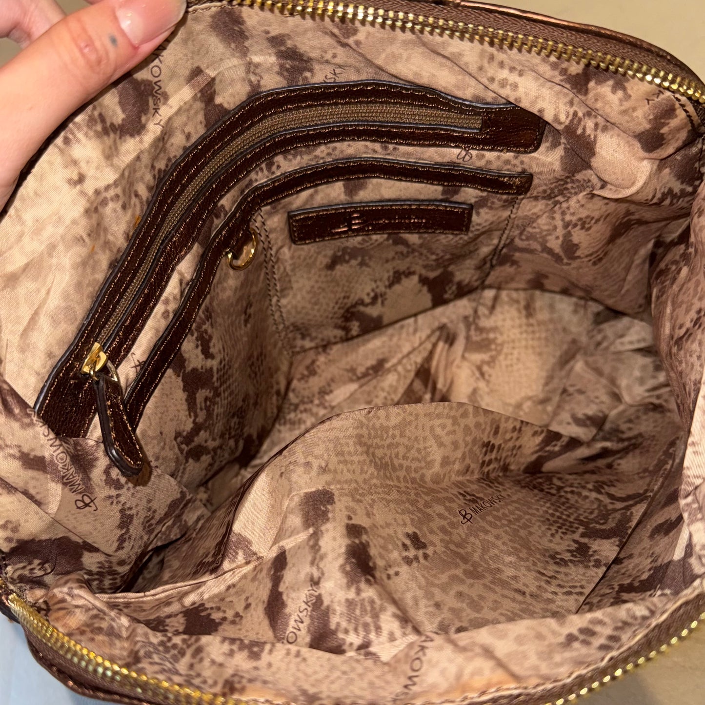 Brown leather shoulder bag with gold hardware
