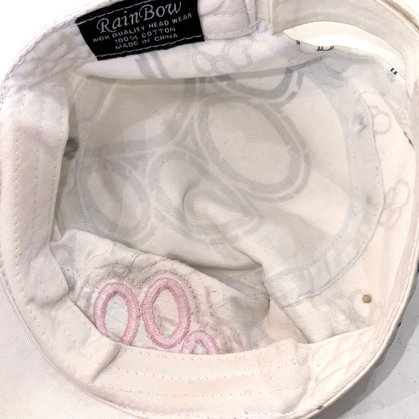 Pink paw white hat
