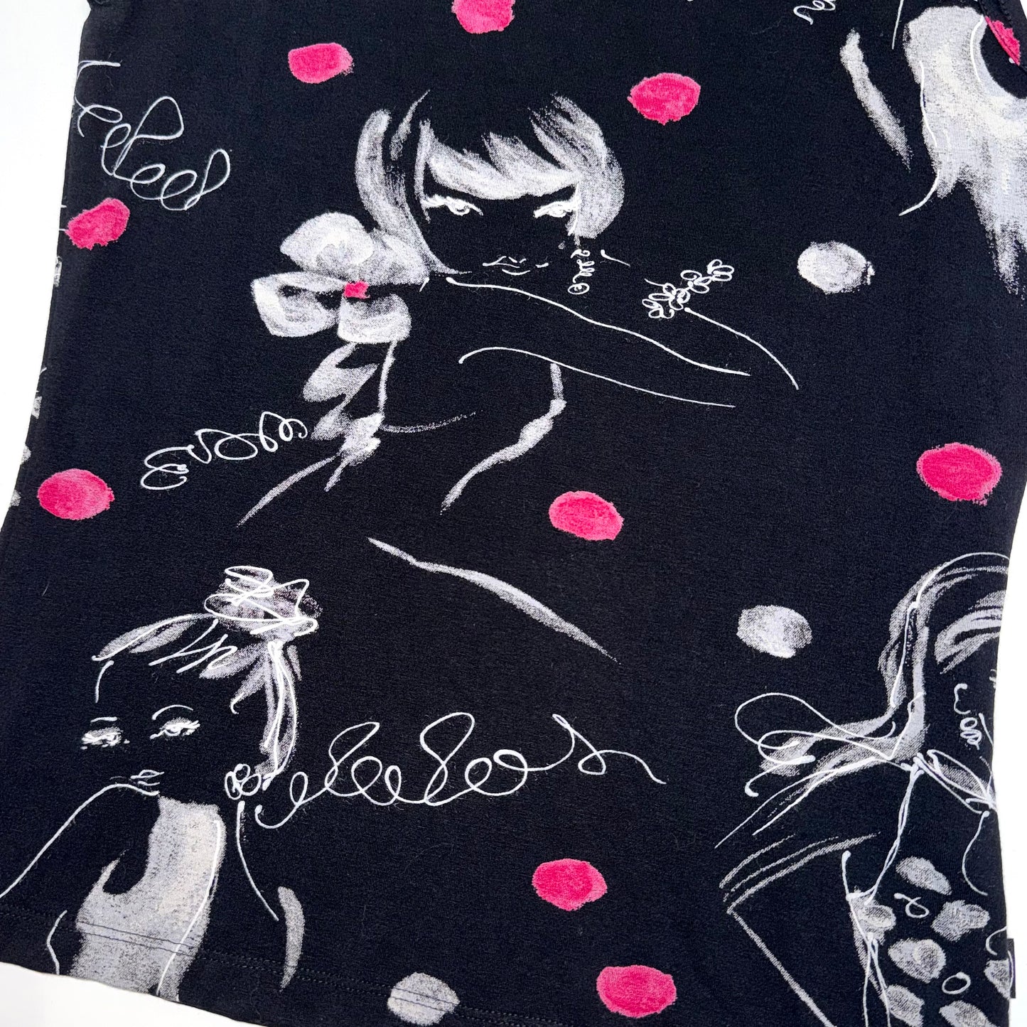 Black polka dot portrait top